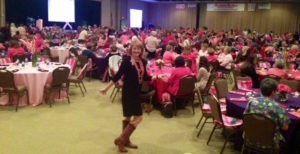 Breast cancer survivor speaker Susan Sparks in her cowboy boots -- and a sea of pink -- at CHI St. Luke's Health in Lufkin, TX