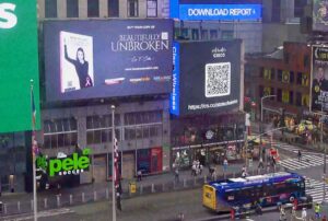 Lisa Crites' memoir Beautifully Unbroken lighting up Times Square. Photo courtesy of Lisa Crites